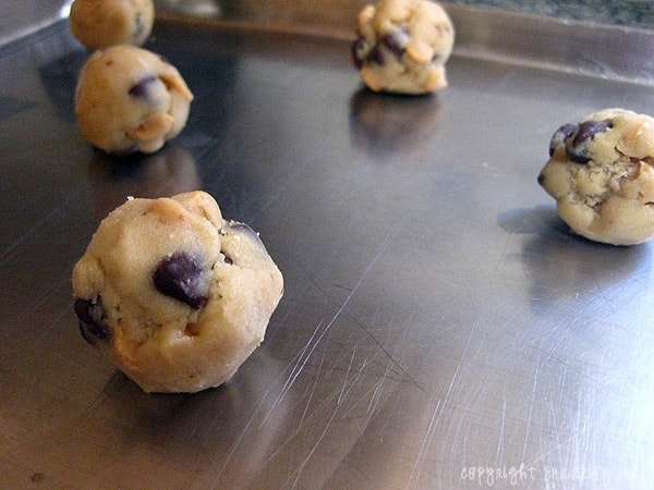 Peanut Butter and Chocolate Chip Cookies Drop Onto Baking Sheet