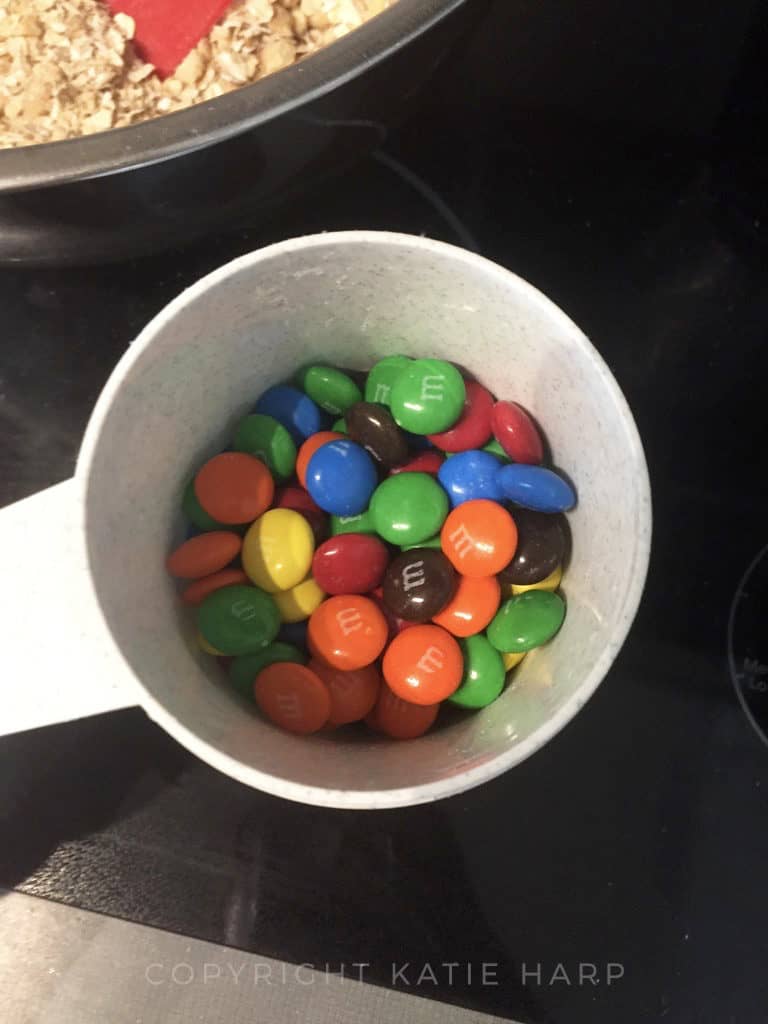 Measuring out half a cup of M&Ms