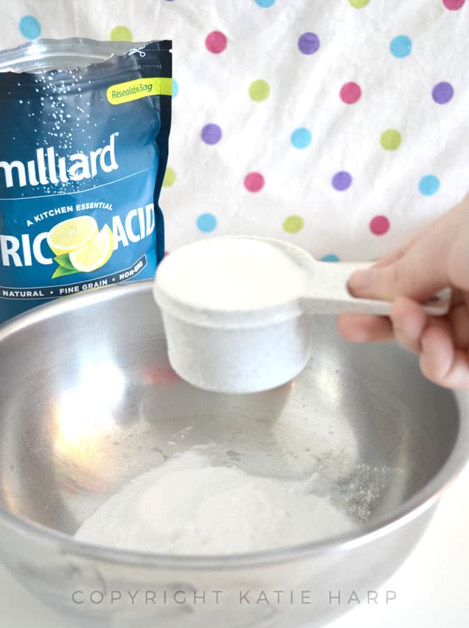 Adding citric acid to the mixing bowl