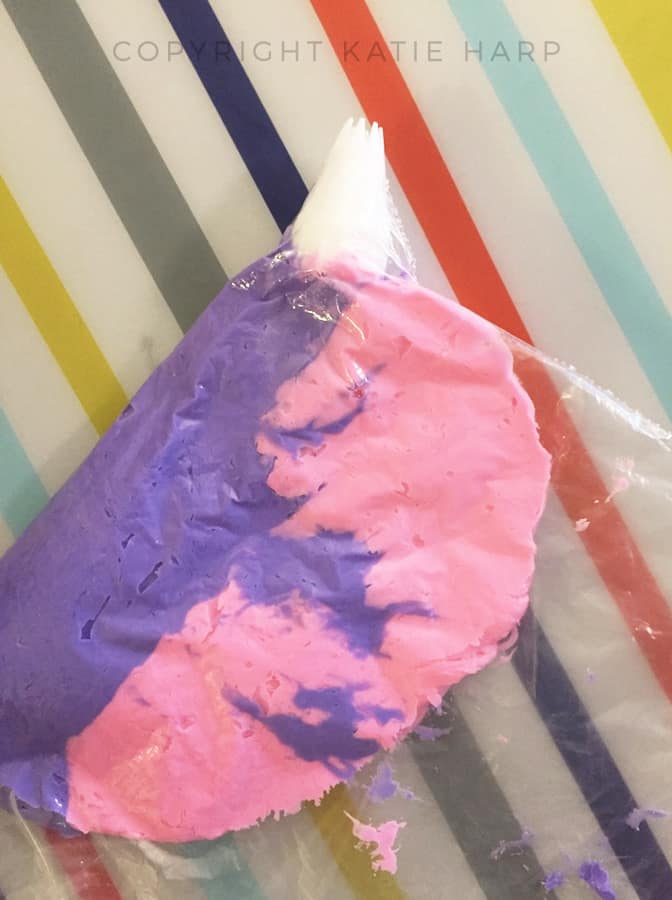 Putting the two frosting colors into a piping bag