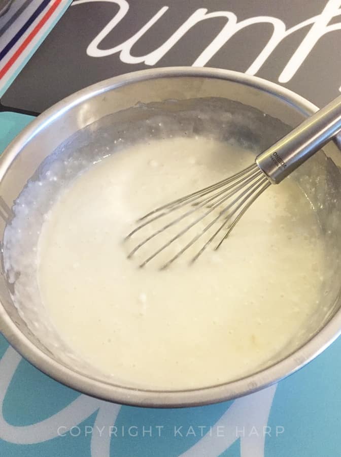 Whisking the egg whites, oil, and water into the cake mix