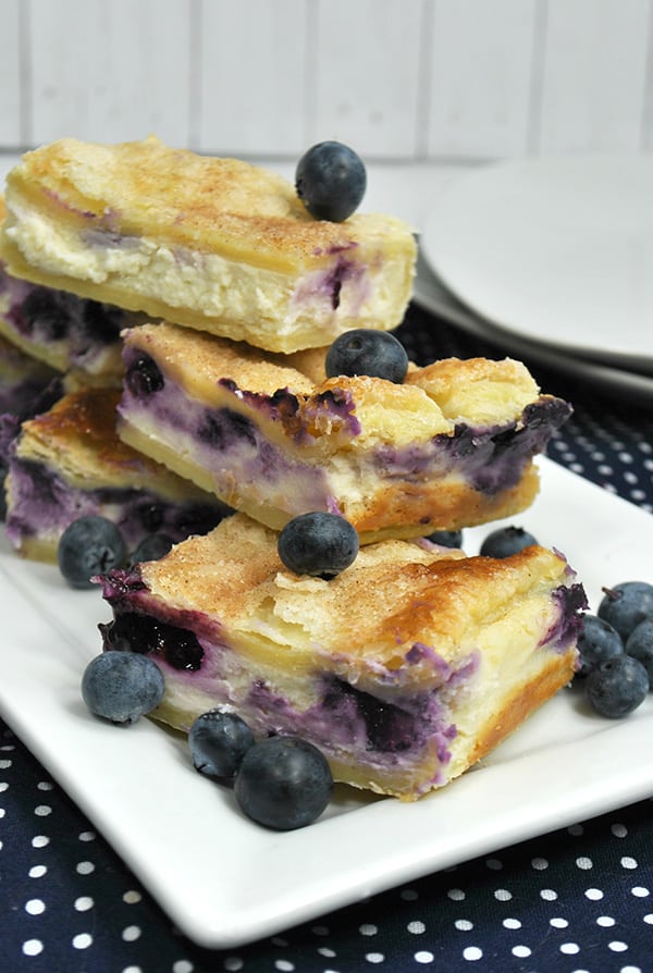 Sopapilla blueberry cheesecake bars with blueberries