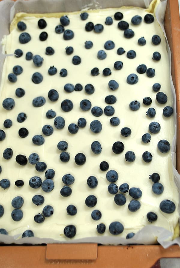 Adding blueberries onto the cream cheese mixture