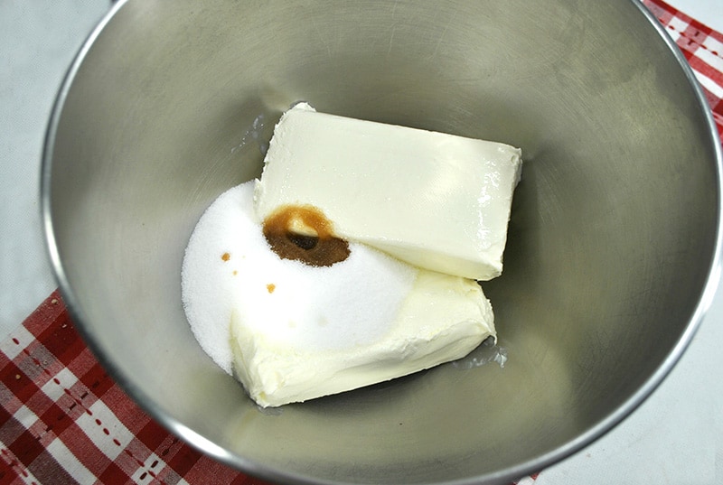Cream cheese and sugar in a bowl