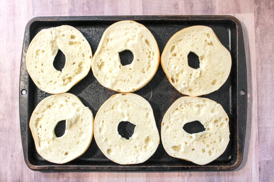 Lay the bagels flat onto a baking sheet