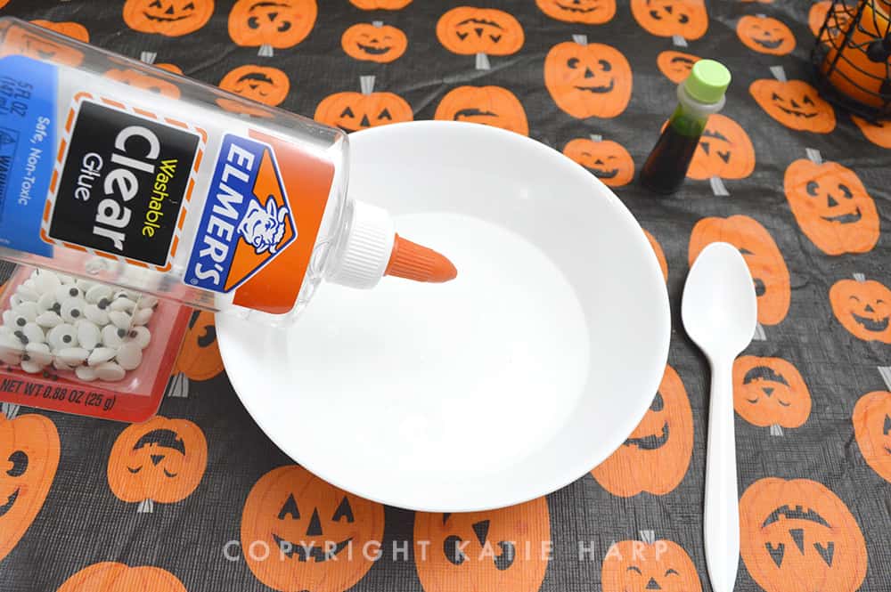 Pouring clear glue for the Halloween slime