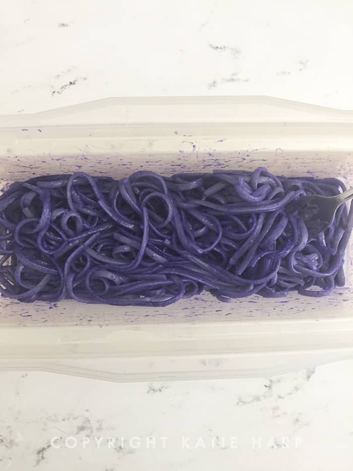 Mixing in the purple food coloring