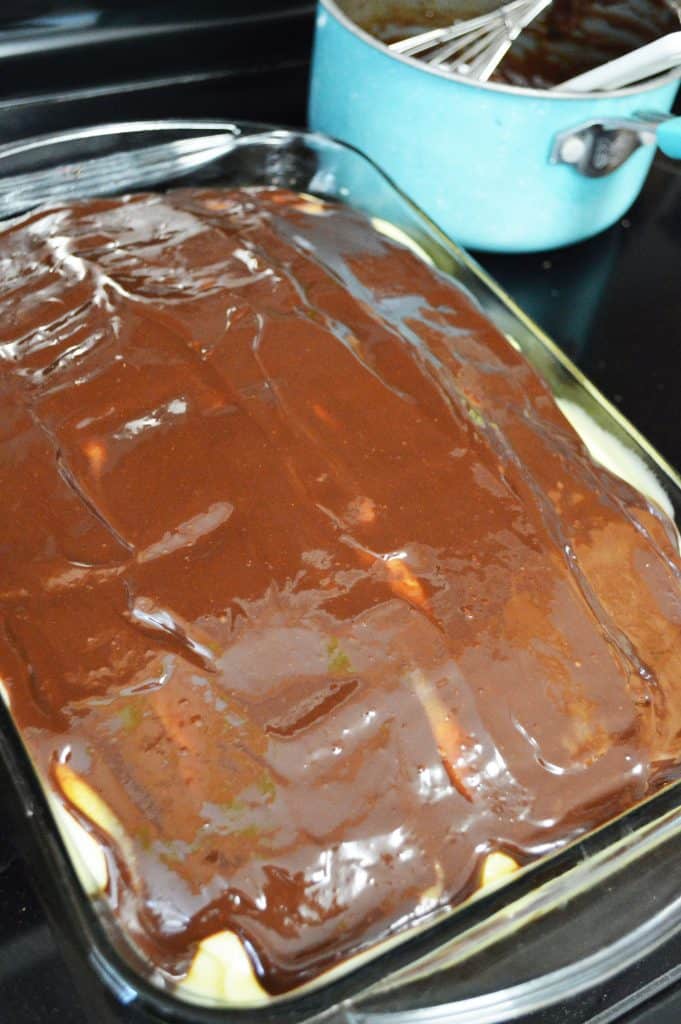 Spreading the chocolate ganache over the cake