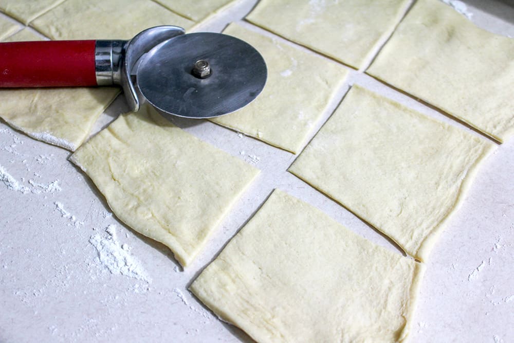 Cutting the crescent dough into pieces