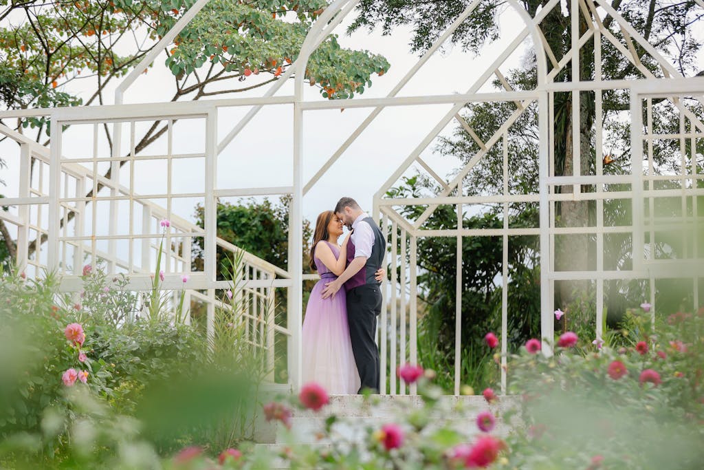 Couple embracing in a garden during an engagement photo shoot in Davao City.